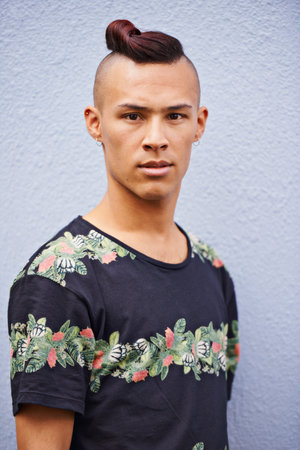 Serious, confidence and portrait of man with fashion for cool style, trendy clothes and relax by...