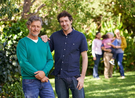 Portrait, dad and man with embrace for bonding, affection and love to relax in garden, backyard and...