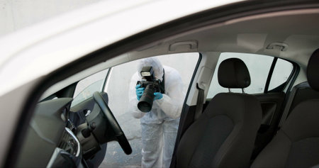Forensic, investigation and photography of evidence in crime scene car for accident, burglary and research analysis. Science, csi and photographer with pictures in transport vehicle for observationの写真素材