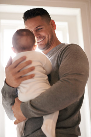 Love, happy or father and baby in a house with care, trust and child development, support or...