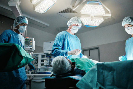 Doctor, surgery and employees in hospital, theater and emergency room busy in medical career. People, healthcare workers and nurses with patient for procedure, medicine and operation for healthの写真素材