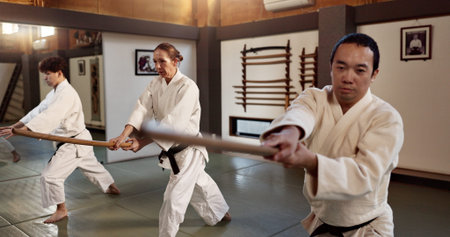 Aikido, black belt or fight class with weapon in training or physical self defence exercise in dojo....