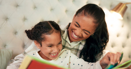 Reading, mother and daughter in bedroom with book, teaching and happy learning time in family home....