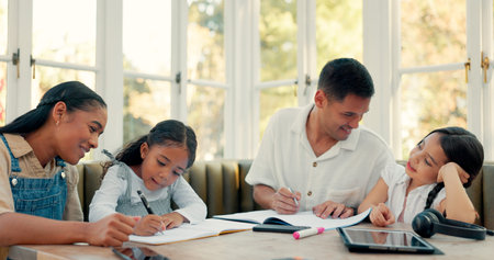 Writing, children learning and parents in home education, math support and helping at kitchen table. Mother, father and girls for school homework, family teaching and project, development or languageの写真素材