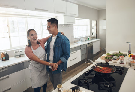 Dancing, cooking and couple in kitchen together with healthy food, relationship and bonding in home....