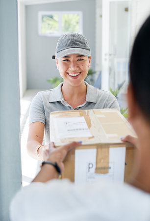 Woman, portrait and delivery at front door with package for customer or logistics, ecommerce or online shopping. Asian person, face and product parcel box with distribution, supply chain or exportの写真素材