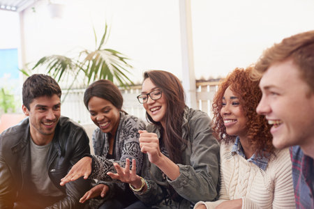 Friends, comedy and happy together outdoor, relax at restaurant for bonding and reunion with laughing. Funny story, catch up and social gathering with support, trust and care in friendship groupの写真素材