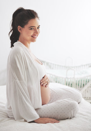 Pregnant, woman or smile in bed, maternity or dream of health, wellness or vision of peace in home. Pregnancy, mama or thinking of rest to imagine, future or motherhood as idea of maternal comfortの写真素材
