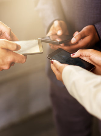 People, together and hands with smartphone in circle for teamwork, support and networking. Diversity, technology and collaboration with connectivity for online voting, virtual poll and digital ballotの写真素材