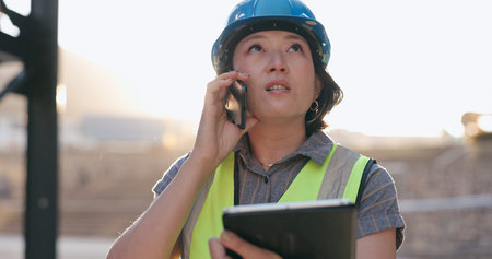 Asian woman, phone call and tablet, construction worker and inspection of building site for project...