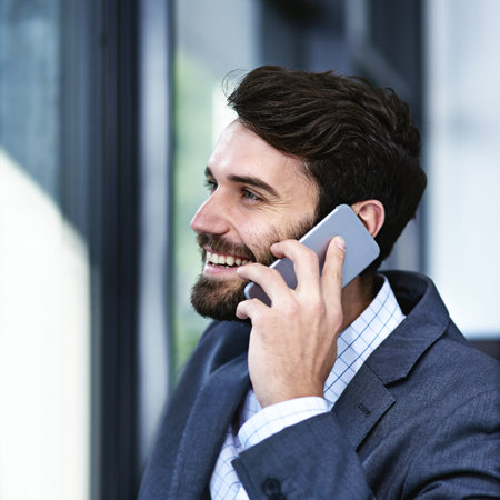 Happy, businessman and phone call with discussion for chat, proposal or communication by window at...