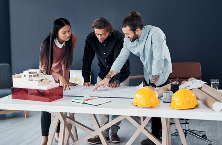 Architecture, teamwork and blueprint with discussion in office for interior layout, floor plan or...