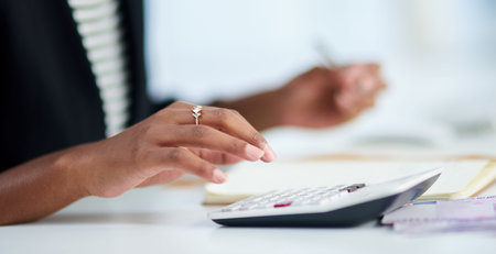 Accounting, woman and hand with calculator in office for company review, budget and analysis....