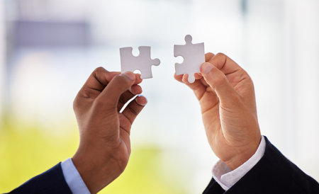 Hands, puzzle and people for business solution with connection, synergy or integration at agency. Teamwork, toys and creativity for problem solving, strategy or link with ideas for vision at companyの写真素材
