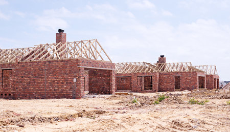 House, brick wall and real estate project for construction, development and dream home renovation. Property, building and architecture with structure, worksite and suburban improvement and designの写真素材