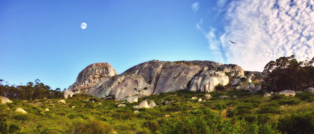 Nature, mountains and green grass with rock formation for travel destination on holiday in Cappadocia, Turkey. Natural landscape, sustainable environment and ecosystem in countryside for vacationの写真素材