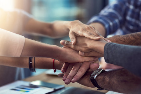 Diversity, teamwork and hands together in office for corporate support, company collaboration and...