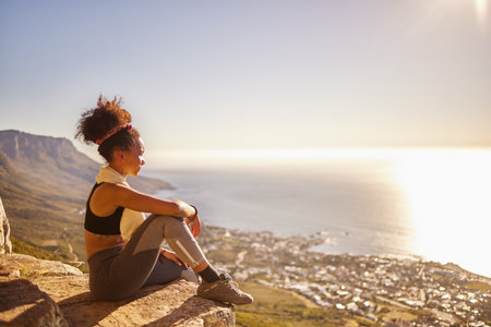 Relax, peace and black woman on mountain for workout, training or exercise for wellness, sport or health. Yoga, zen or gen z girl by nature, environment or outdoor with for fitness, vision or freedomの写真素材