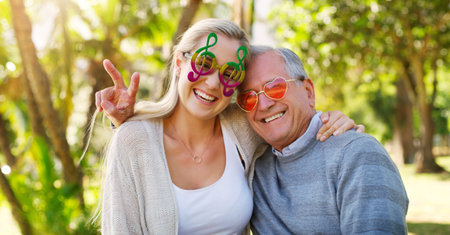 Park, portrait and senior father with daughter, woman or love for care, hug or support in England....