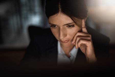 Thinking, night and ideas with woman, problem solving or solution with lawyer or attorney. Planning for court case, legal aid or evening with person or pro bono with research for defence or tax auditの写真素材