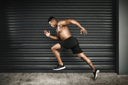 Shirtless, black man or sprint at speed, fitness or vision of exercise, energy or thinking of health. Fast, muscular or male runner as planning, idea or dream of cardio, training or power performanceの写真素材