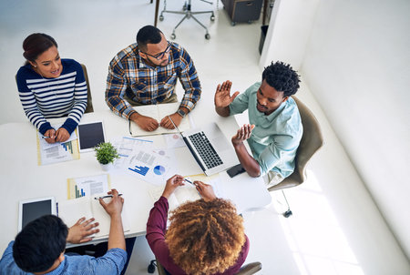 Startup, talking or top view of people in discussion or meeting for paperwork, review or...
