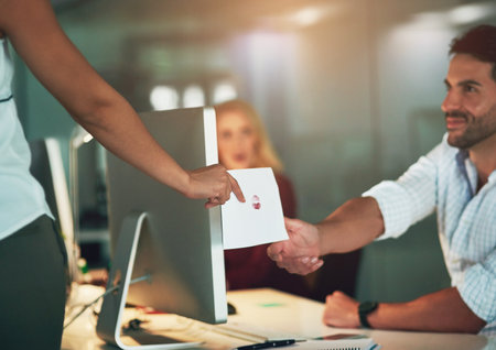 Office, love and business people with romance in note flirting, giving and gift of letter. Company, professional employee and hand with kiss on paper at desk for relationship, offer and messageの写真素材