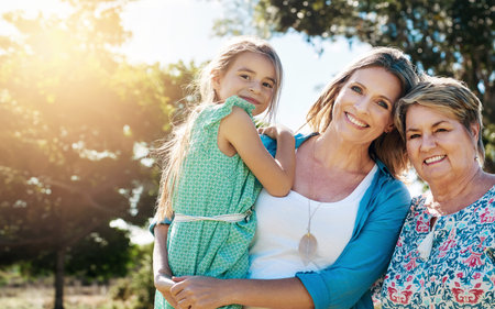 Portrait, grandmother and mama with girl, outdoor and happiness with hug, sunshine and bonding...