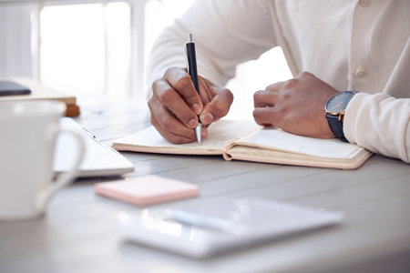 Notebook, hands and man with pen, journal and reflection with creative, ideas and thinking for writing. Writer closeup, inspiration and notes list, planning and brainstorming with diary and paperの写真素材