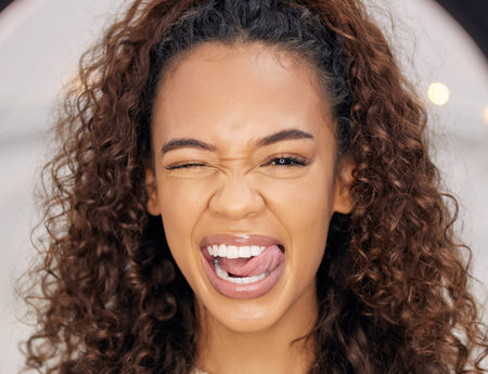 Emoji face, woman and happy in studio for skincare, beauty and cosmetics or collagen for wellness. Gen Z, Brazilian female person and excited for dermatology, glow and microblading results in salonの写真素材