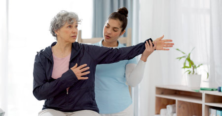 Physiotherapy, arm and senior woman consulting physiotherapist for injury, healthcare and...