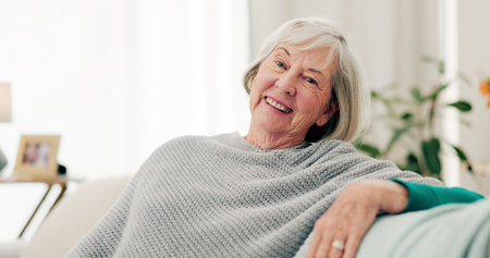 Face, funny and senior woman on couch, home and happiness with retirement, relax and cheerful....