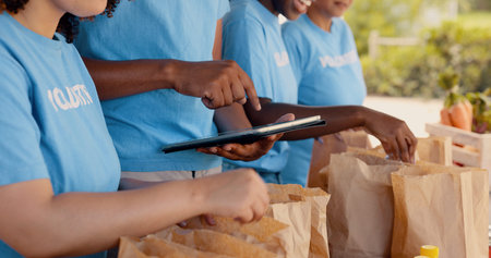 Volunteering, group of people and tablet for food donation, community service and poverty support...