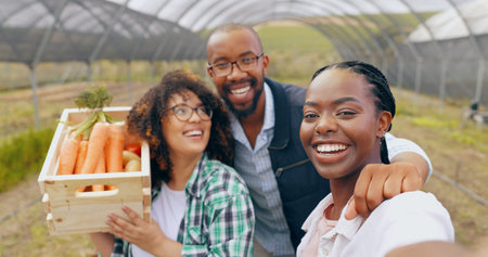 Farm, selfie and people in greenhouse for vegetable harvest, agriculture or small business. Sustainability, face or happy farmer team in nature for agro profile picture, social media or startup blogの写真素材