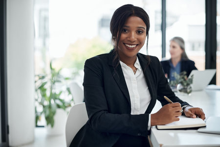 Black woman, portrait and writing with book in business at office for finance, report or corporate policy. African, female person or financial advisor with smile, notes or diary for company revenueの写真素材