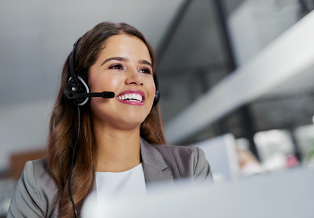 Happy woman or CRM and telemarketing at call centre for customer service, contact and questions. Female person or virtual assistant and hotline with headphones for technical support, help and adviceの写真素材