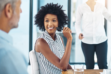 Talking, business woman and colleagues in office for meeting, teamwork and collaboration or brainstorming. Female person, speaking and employees listening to conversation for partnership and supportの写真素材