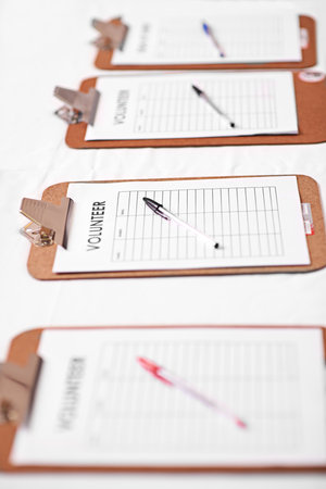 Help, sign up and volunteer with clipboard, charity and application for community service, form or ngo. Empty, documents or paperwork with pen, join us or signature with cooperation or participateの写真素材