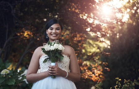 Woman, portrait and happy by wedding in garden for marriage celebration, event and confident or...