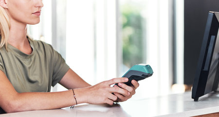 Woman, business and credit card reader in salon for payment, transaction or client customer service. Hairdresser, POS and hairstylist with rfid technology for purchase, processing or machine codeの写真素材