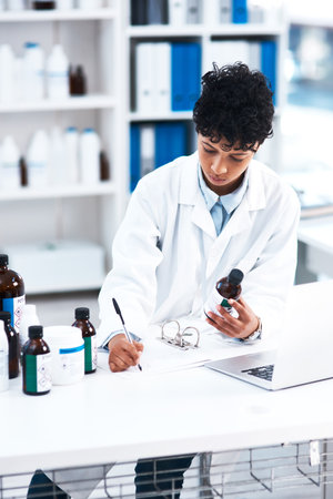 Woman, doctor and document for research, chemical and pharmaceutical development for medicine. Female scientist, notebook and innovation in laboratory with medical, analysis and bottle in laboratoryの写真素材