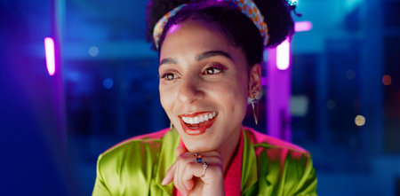 Woman, night and excited in office with neon, tablet or scroll for reading with problem solving at...