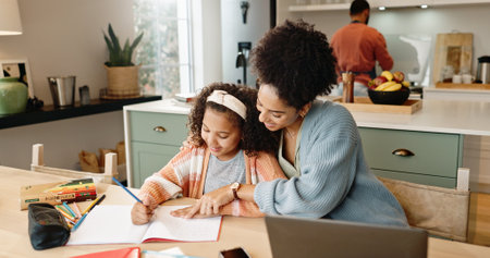 Child, laptop and question for knowledge, learning and growth for future or education. Woman, student and kitchen for help, studying and support or home school for development or writing assessmentの写真素材