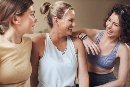 Woman, group and friends for relax in yoga class, activewear and smile for fitness in wellness centre. Workout, sport and training in studio for flexibility, pilates and health and holistic hobbyの写真素材