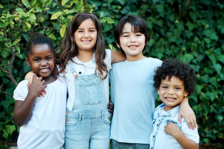 Children, diversity and portrait in garden for friends, happiness and party with birthday celebration. School kids, smile and together in backyard for summer break, vacation and holiday with memoryの写真素材
