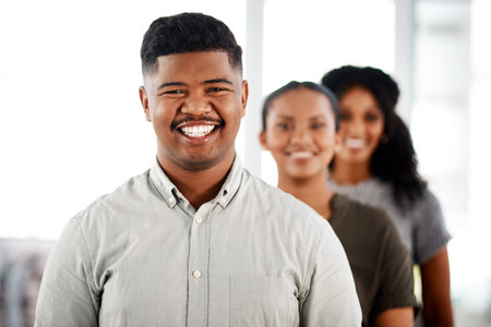 Businessman, office and team in portrait with smile, confidence and trust in workplace. Startup, career and about us with diverse happy coworkers in company with unity, respect and collaborationの写真素材