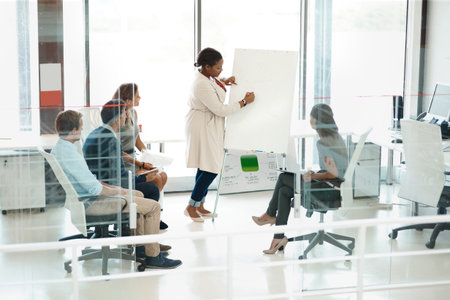 Woman, presentation and colleagues in boardroom or meeting, business planning and white board...