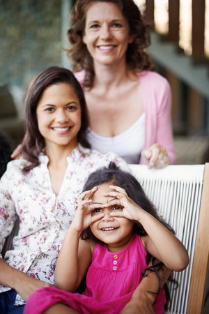 Portrait, happy kid and grandmother with mom in home for care, support or people bonding together to...