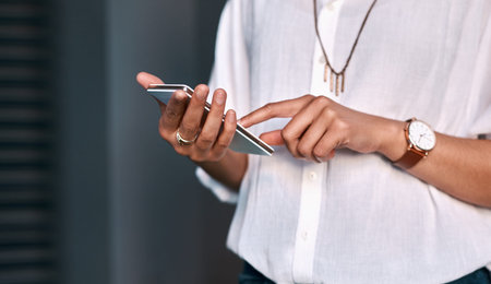 Phone, hands and business woman in office networking on internet, mobile app or website for email....