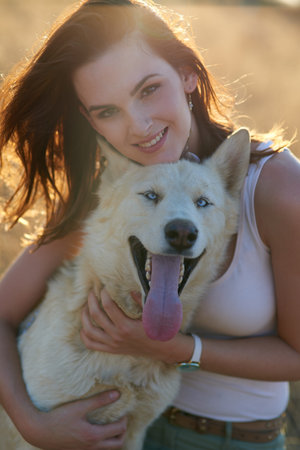 Woman, dog and hug in portrait, park and care with bonding, connection and adventure in summer....